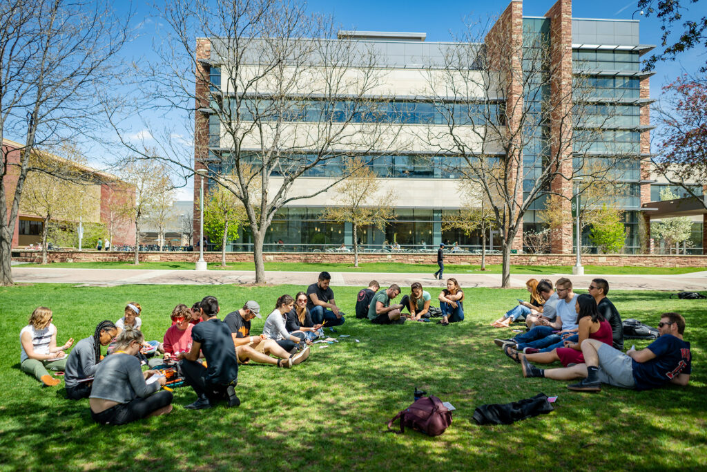 Students enjoy a warm spring day on the Colorado State University campus