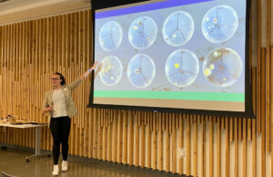 Sophomore neuroscience student Mikayla Bruce presents "Testing the Effectiveness of a Popular and an 'Off-brand' Disinfectant Spray for Musical Mouthpieces" at the OURA Lab Showcase April 25.