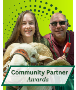 A CSU student and her father pose with Cam the Ram with the words Community Partner Awards in a box below