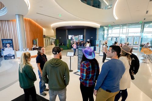 A group gathers for a tour of CSU Spur's lab facilities